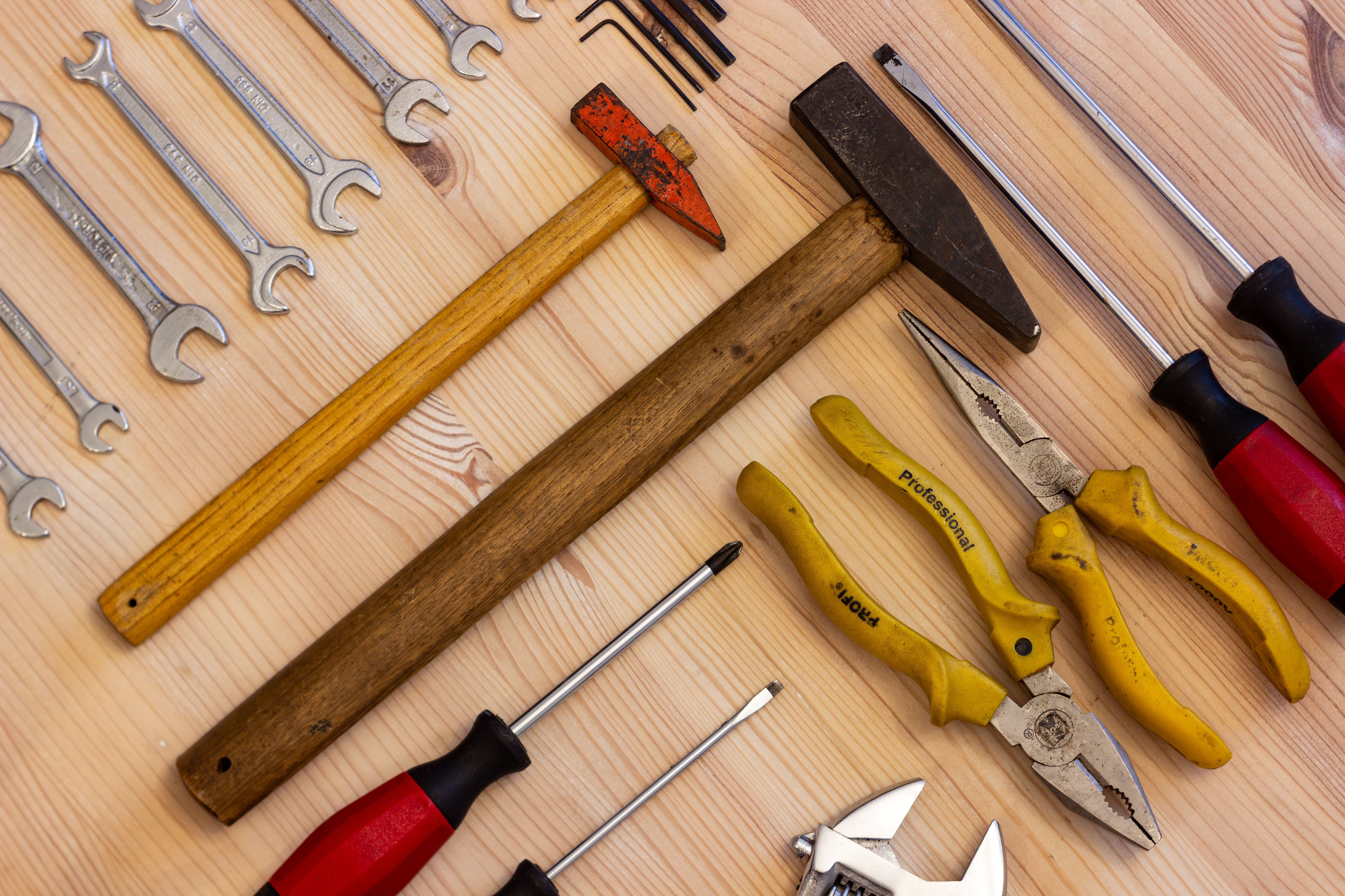 Tools%20arranged%20neatly%20on%20a%20wooden%20tabletop Tools arranged neatly on a wooden tabletop